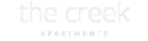 the logo for trace creek apartments with a green background